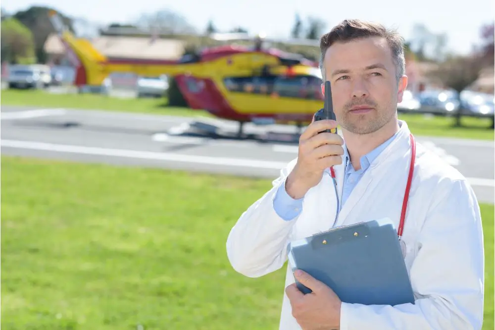 Doctor speaking into walkie talkie