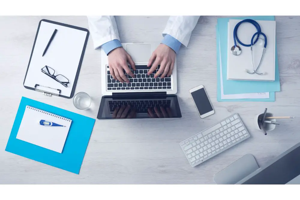 Doctor working at office desk