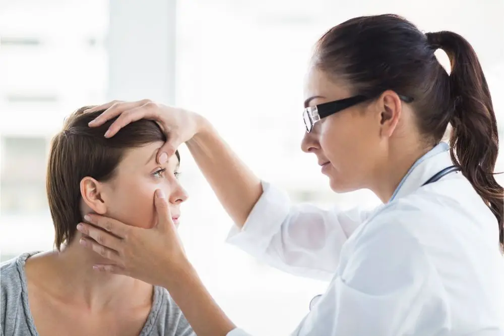 Doctor checking woman eye