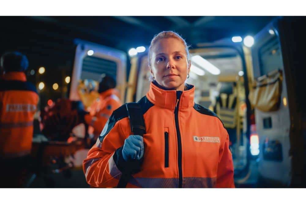 Female EMS Paramedic Proudly Standing in Front of Camera