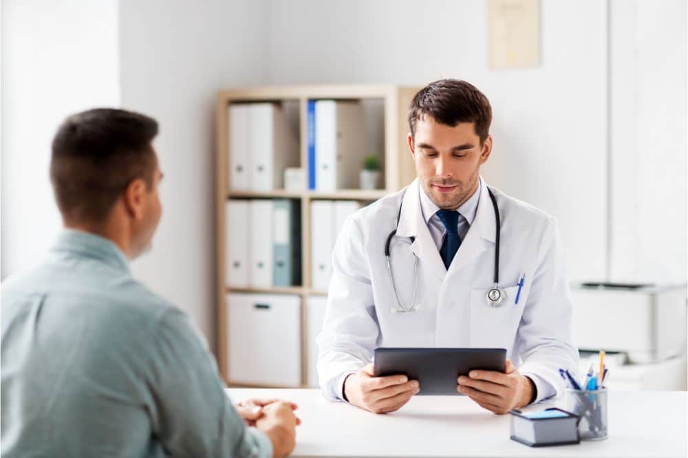 doctor with tablet pc computer and male patient