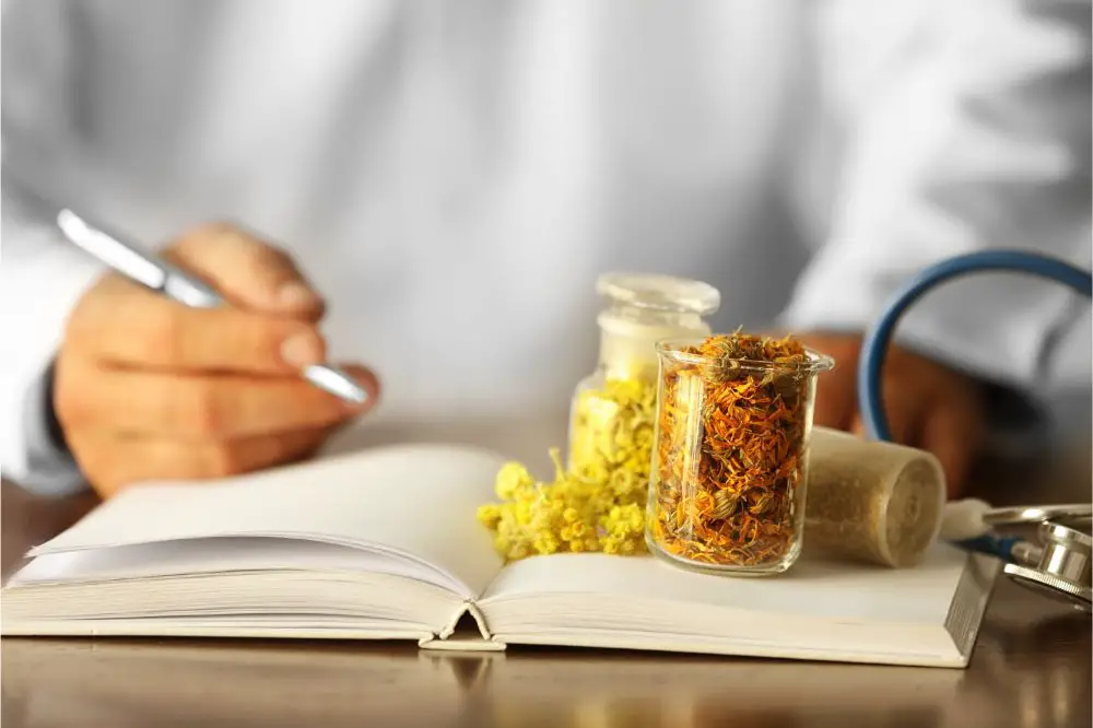 Male doctor with medical recipe book. Herbal medicine concept